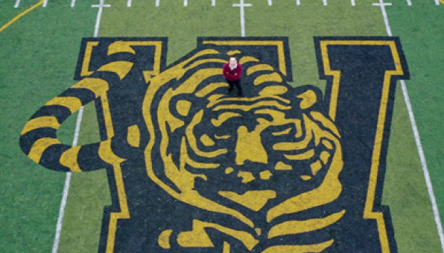 Photo of Mr. Mirus standing below his drone on Joliet West’s football field.
Photo courtesy of Mr. Mirus.