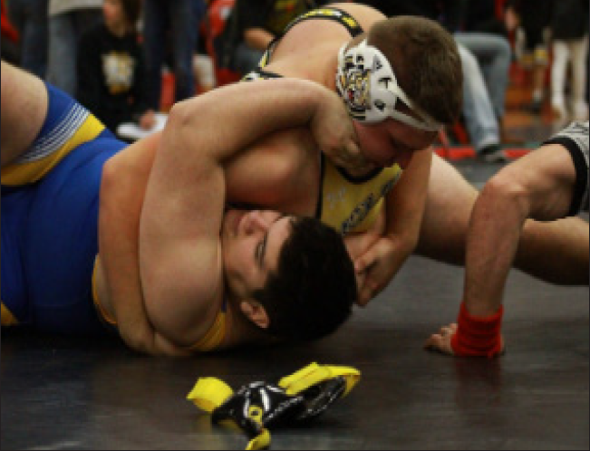 Pictured above is senior Daniel Landando wrestling against a Joliet Central competitor. Photo courtesy of @JolietWWrestle on Twitter.