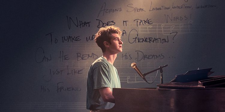 Andrew Garfield stars as composer Jonathan Larson in Tick Tick Boom. The 2021 film tells the story of the aspiring composer in New York City racing to achieve his dreams as he approaches 30 in 1990. Image courtesy of Collider.