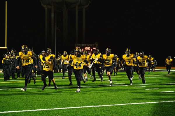 Players run out on senior night on Friday, October 13th vs Plainfield East, where the Tigers won 17-15 to clinch a share of the conference. 